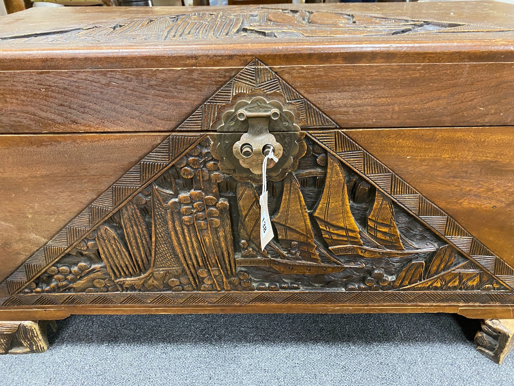 A Chinese carved camphorwood coffer and similar smaller box, larger length 93cm, depth 44cm, height 49cm